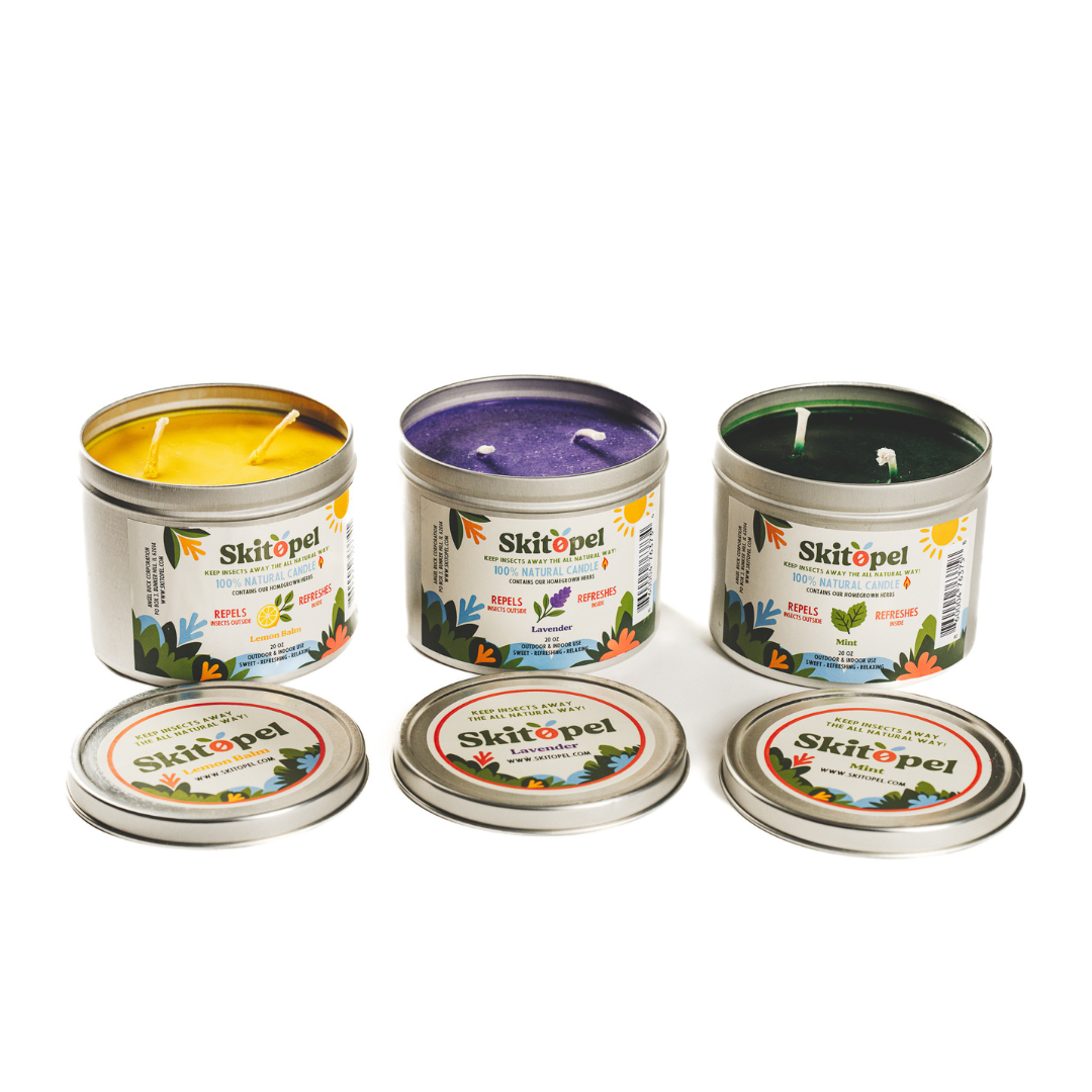 Set of Skitopel candles with visible labels on a white background
